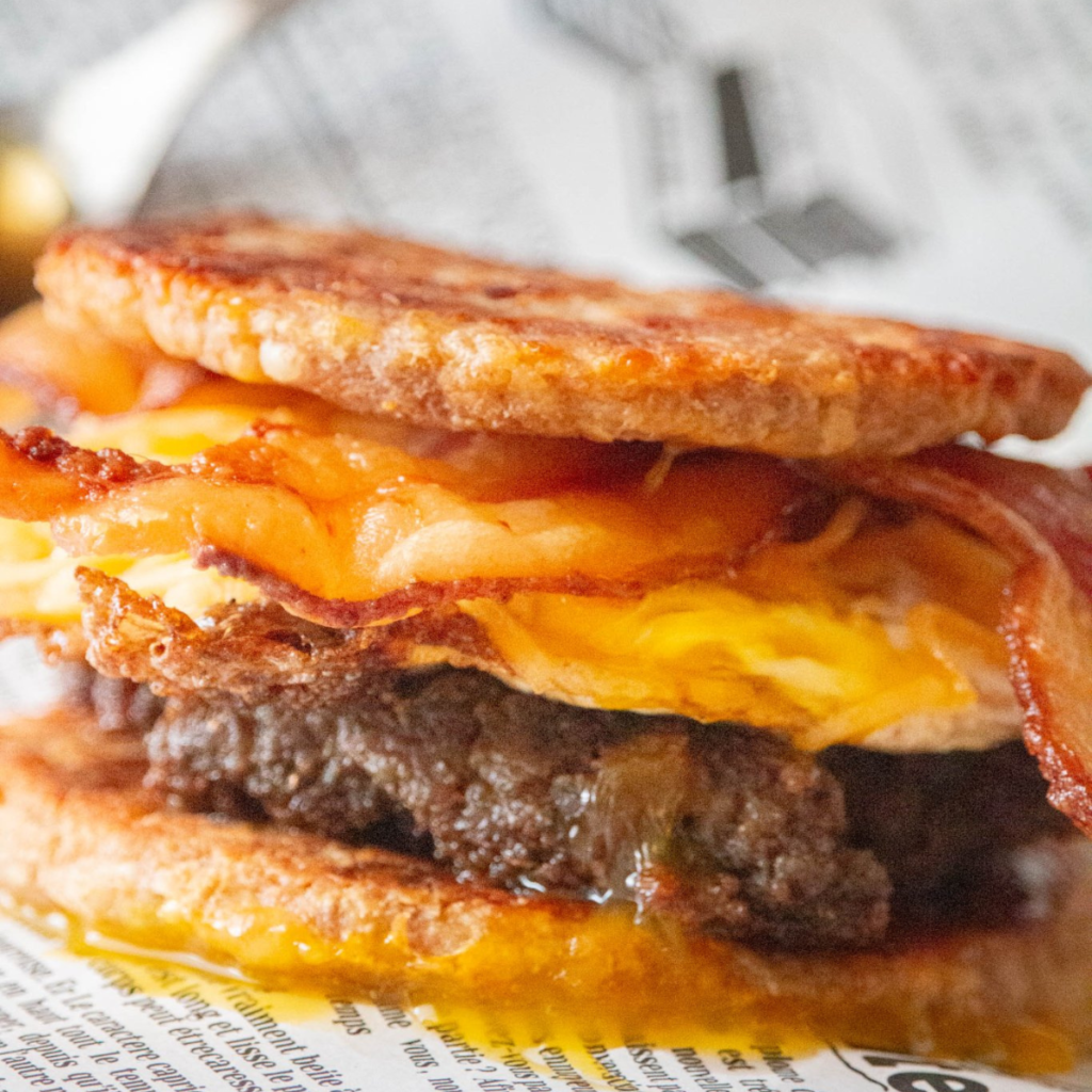 Homemade McGriddle with sausage, egg, and cheese served on a plate, ready to enjoy in under 30 minutes.